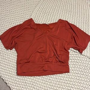 almost silky material, very cute and flattering, little bit of v-neck